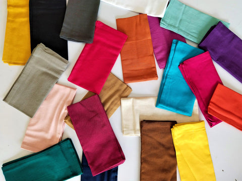 Fingercraft dinner napkins arranged for weddings or everyday meals.