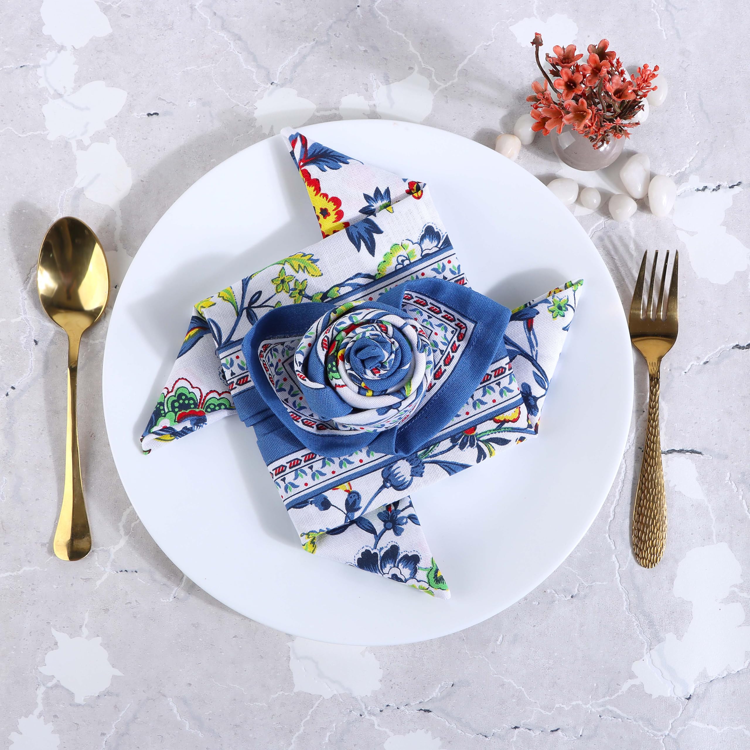 Fingercraft blue floral napkins at a wedding reception table