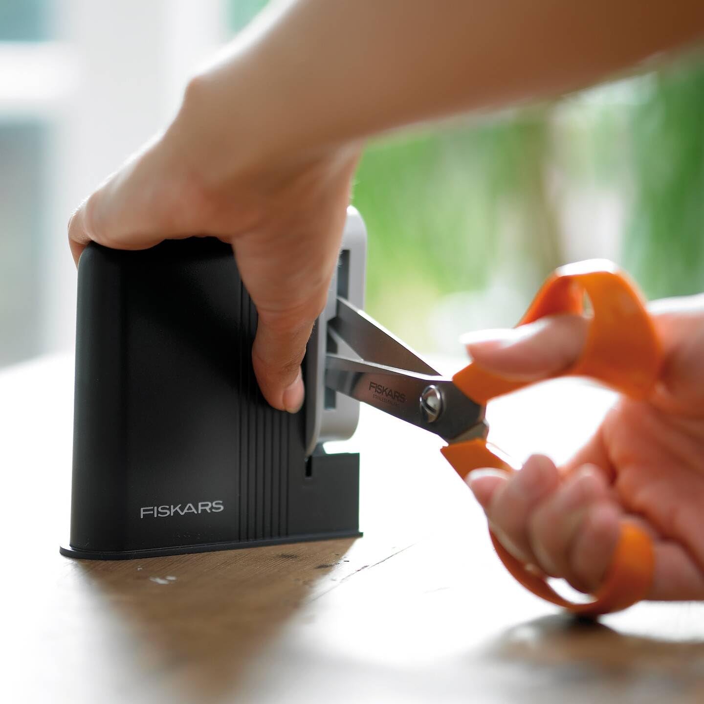 Right- and left-handed users can sharpen Fiskars scissors comfortably.