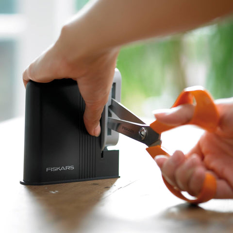 Right- and left-handed users can sharpen Fiskars scissors comfortably.