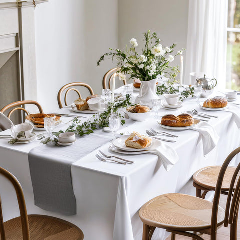 Close-up stitching on Fixwal white tablecloth highlights durable edge and quality.