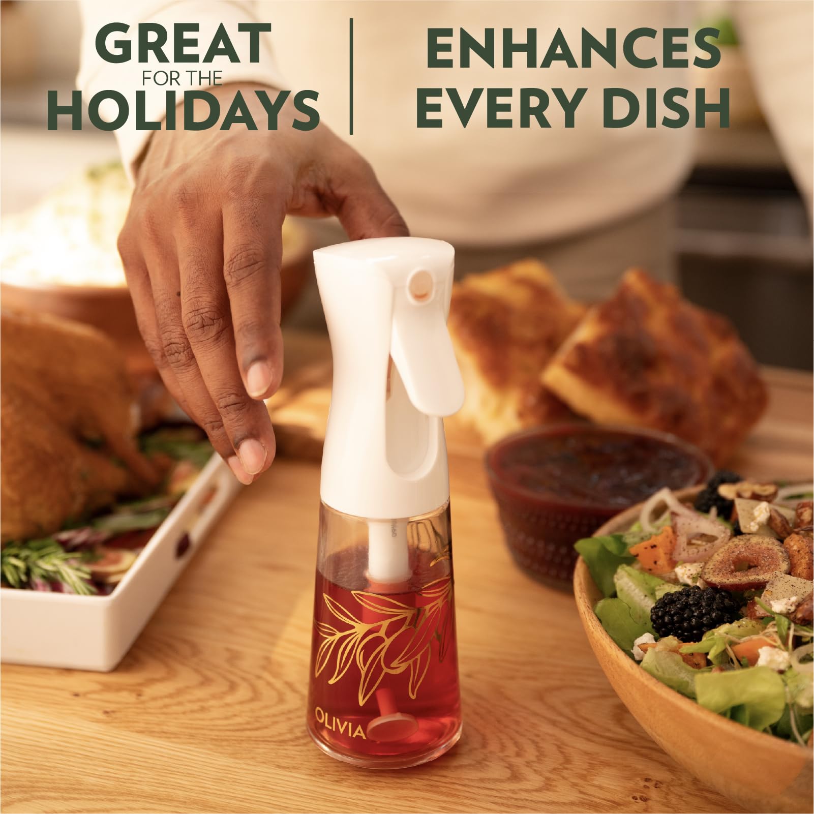 FLAIROSOL OLIVIA sprayer delivering fine mist to coat ingredients evenly.
