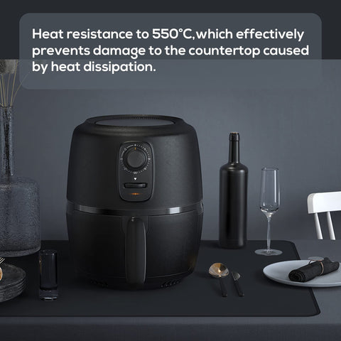 FLASLD waterproof silicone mat rolled beside a coffee maker.