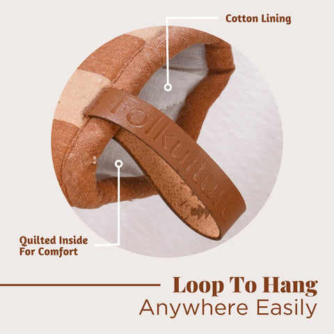 Folkulture oven mitts in use, lifting hot pot safely
