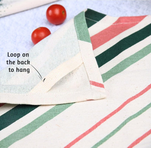 Folkulture Christmas tea towels hanging in a farmhouse kitchen