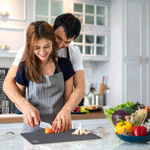 Fotouzy cutting boards stacked to demonstrate space-saving storage.
