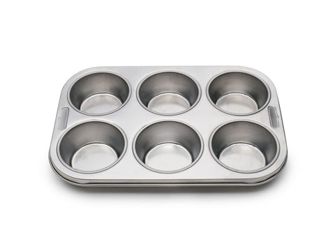 Fox Run 4867 muffin pan lined for baking showing even heat distribution.