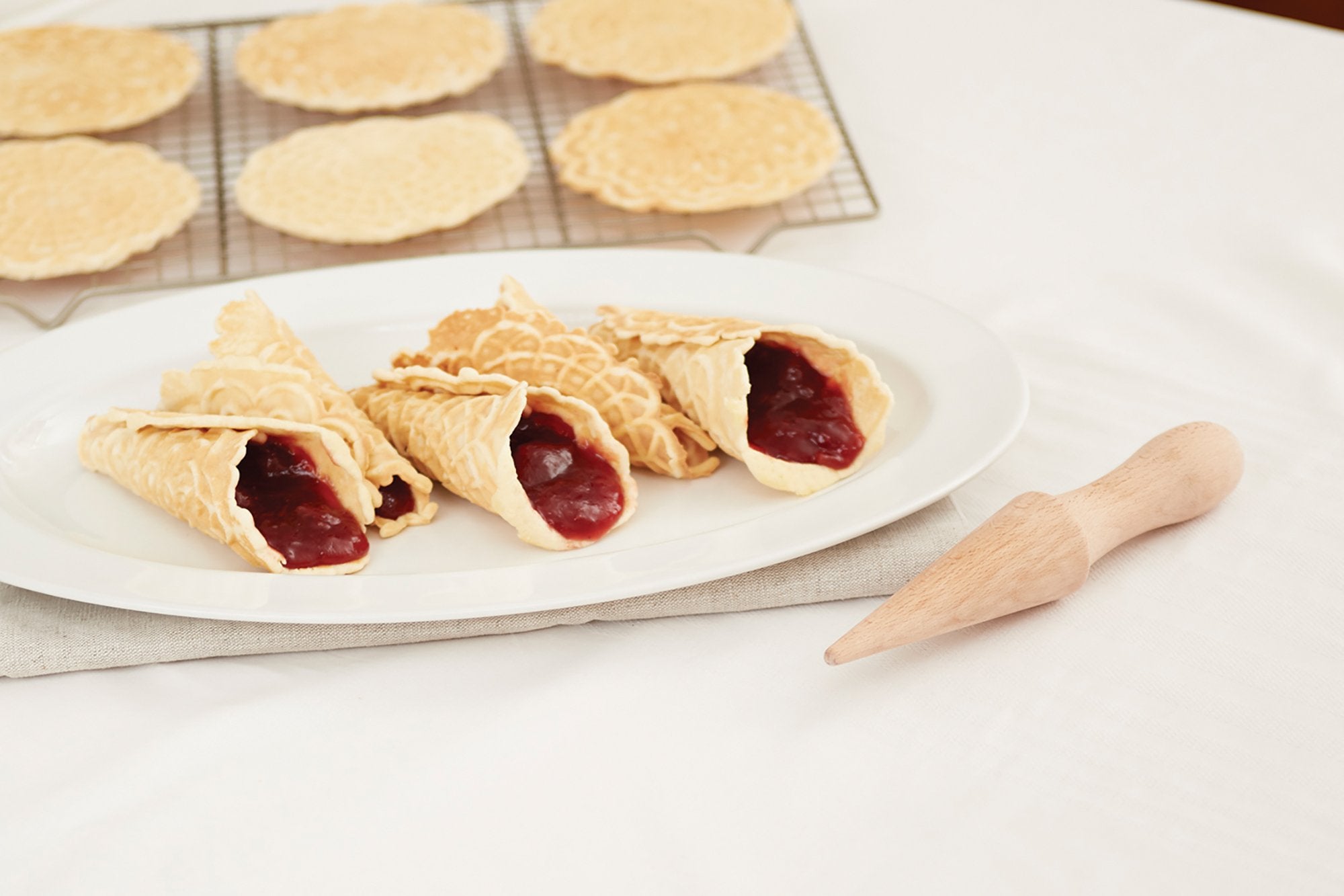 Fox Run krumkake roller tool shaping traditional cookies.