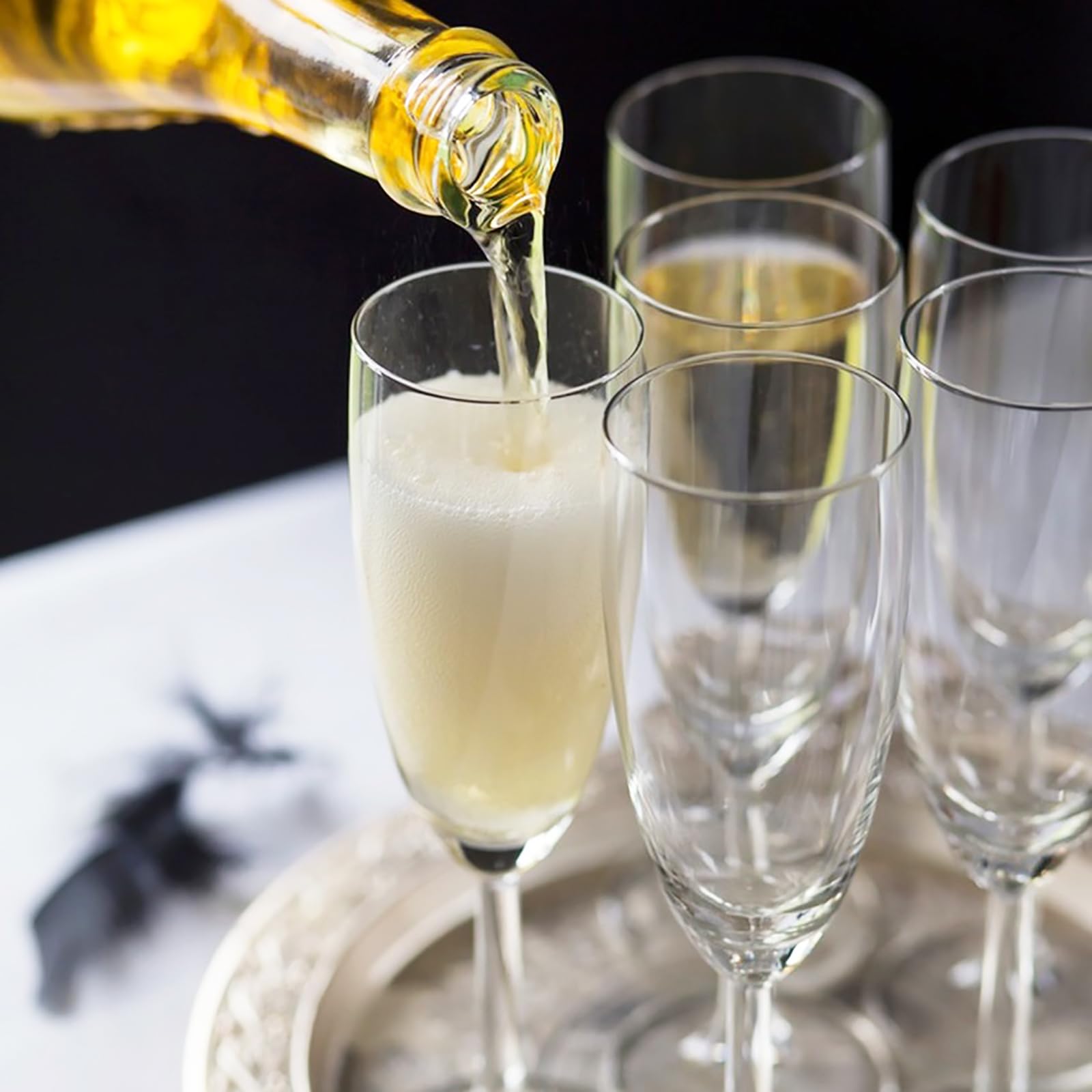 Frcctre weighted-base acrylic wine glasses resist tipping during toasts.