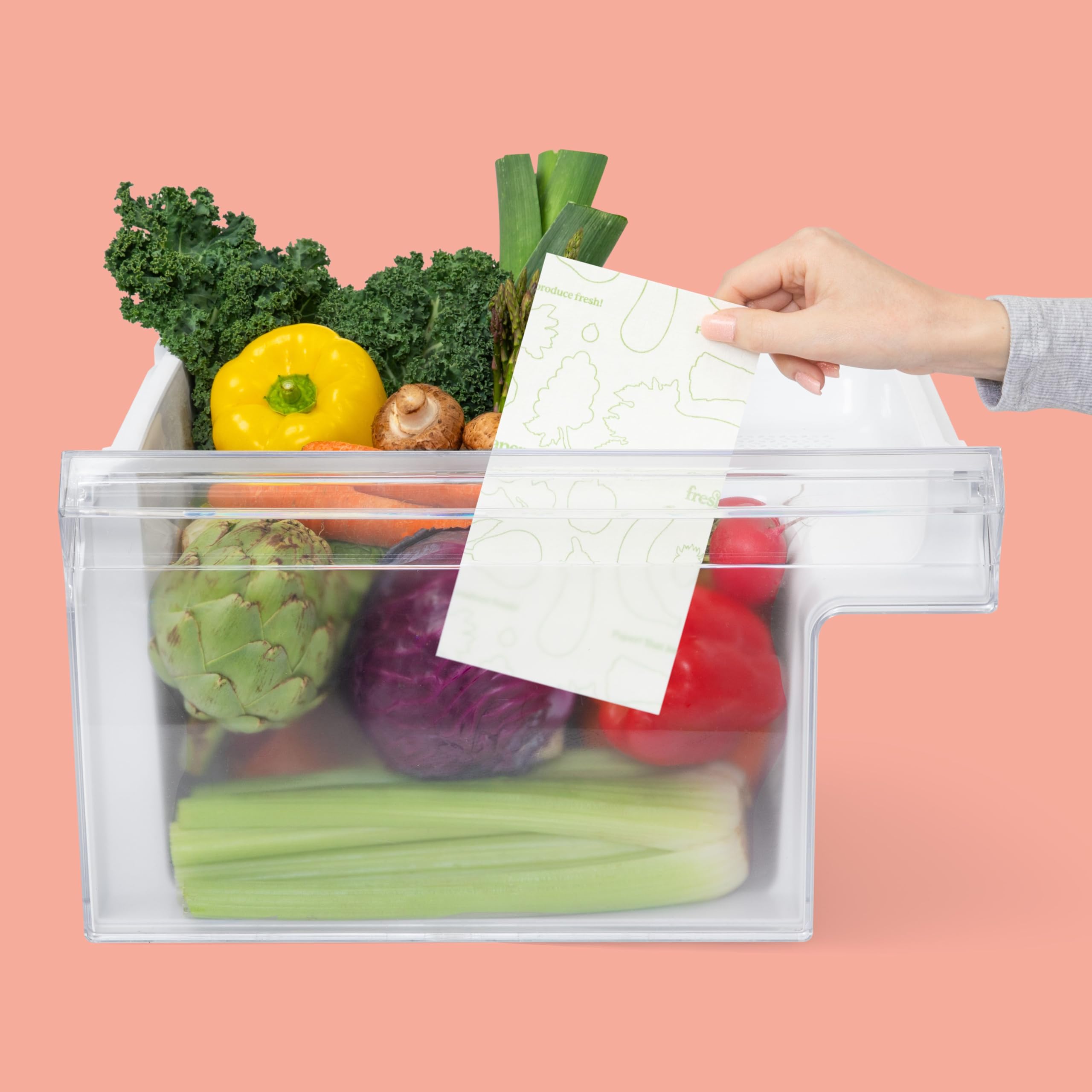 FRESHPAPER sheets in a crisper drawer extend greens' shelf life.