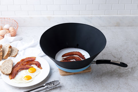 Frywall blocks oil mist while letting steam escape for balanced browning.