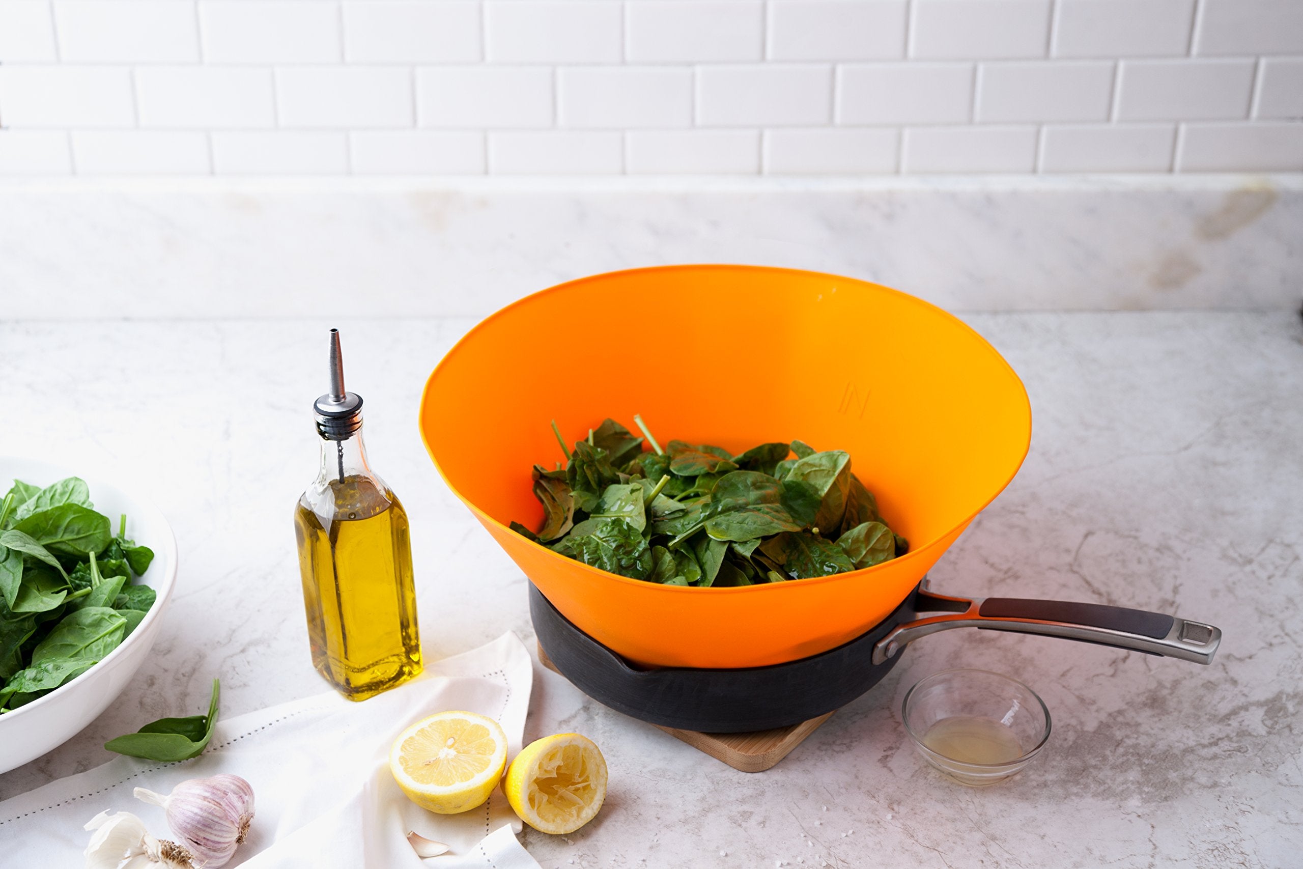 Frywall spillover stopper prevents overflow when sautéing vegetables