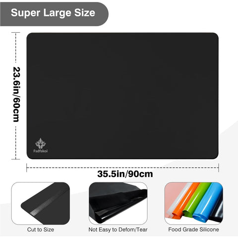 Fsdfskoi silicone mat in black protecting countertops from spills and heat.