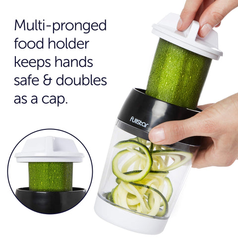 Fullstar safety finger guard protects hands during vegetable cutting.