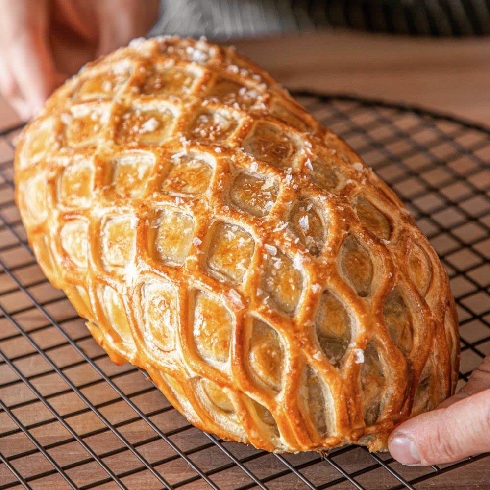 Creative use for pizzas, breads, and cookies with decorative tops.