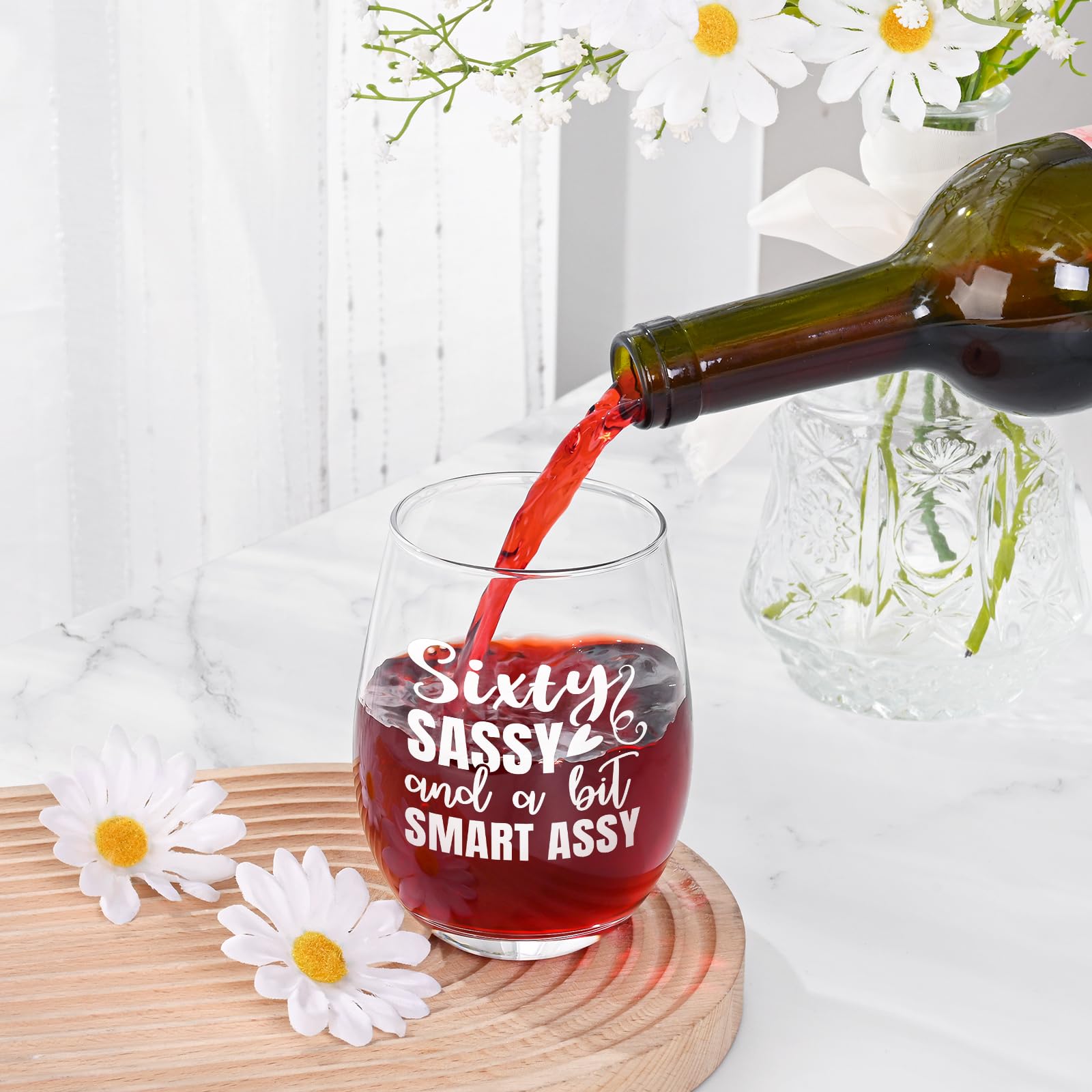 Futtumy sixty-sassy wine glass being held to show comfortable grip for celebrations.