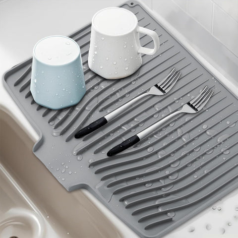 FUYXINGXY gray silicone drying mat folds compactly for storage.