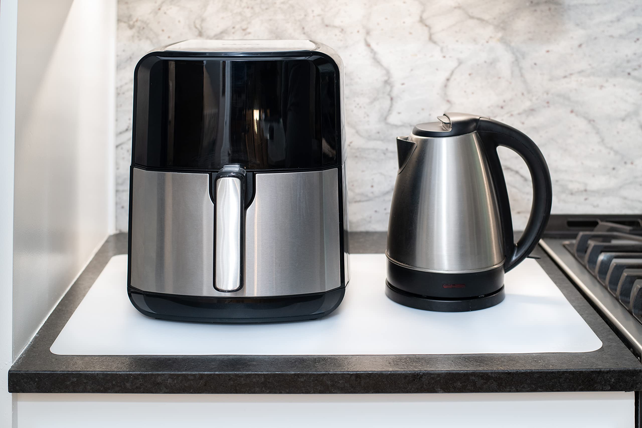 GASARÉ heat-resistant silicone mats withstand hot appliances and cookware safely.