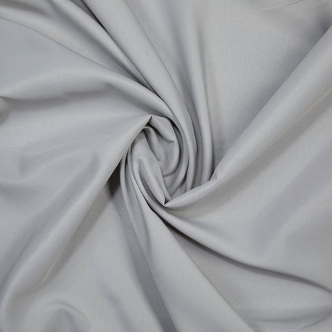 Gee Di Moda wrinkle-resistant tablecloth in silver stays smooth after use.