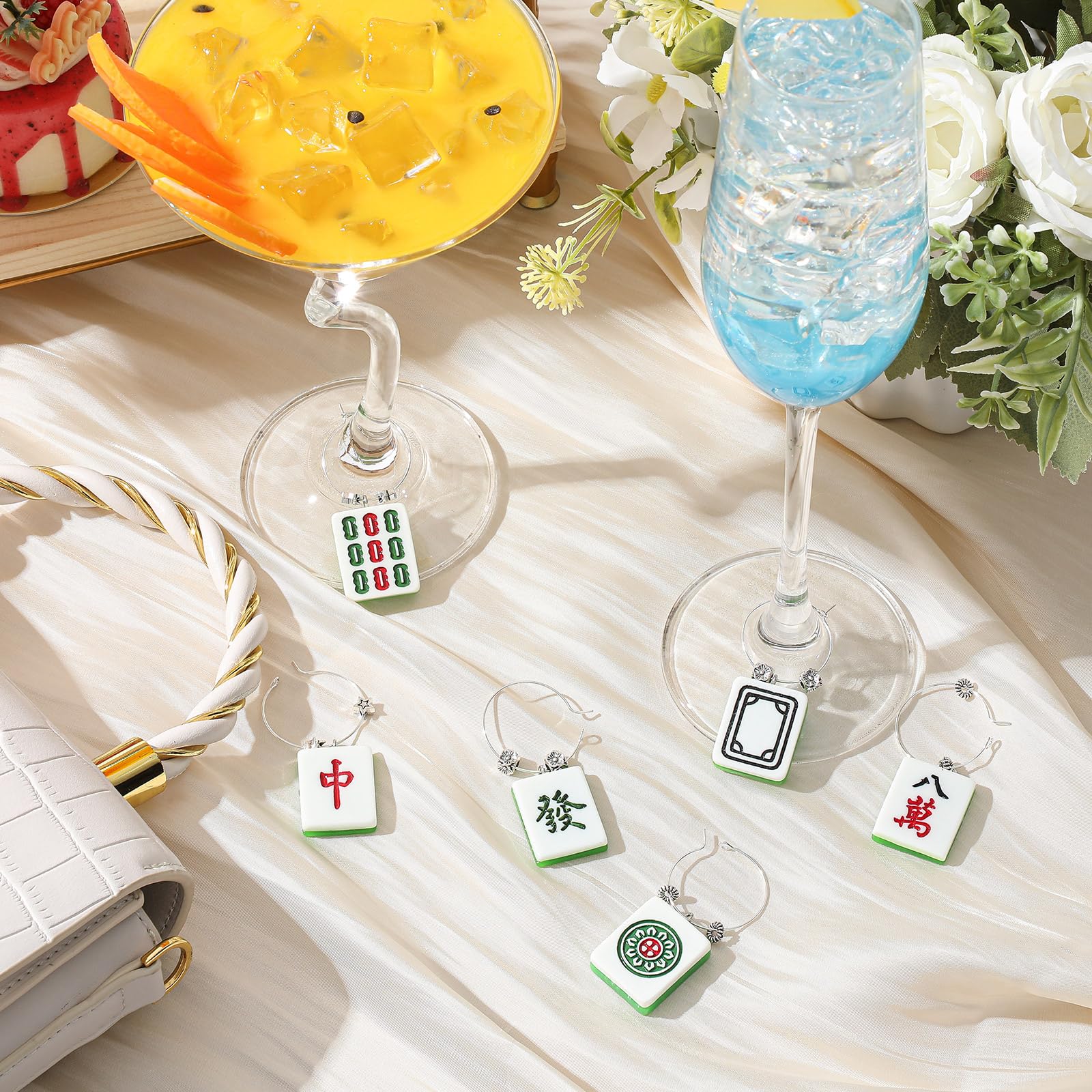 Geelin wine charms showcase detailed Mahjong tile designs for a premium look.