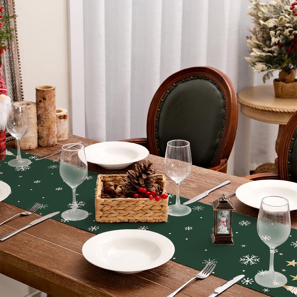Geeory table runner paired with dinnerware and greenery for stylish holiday setup.