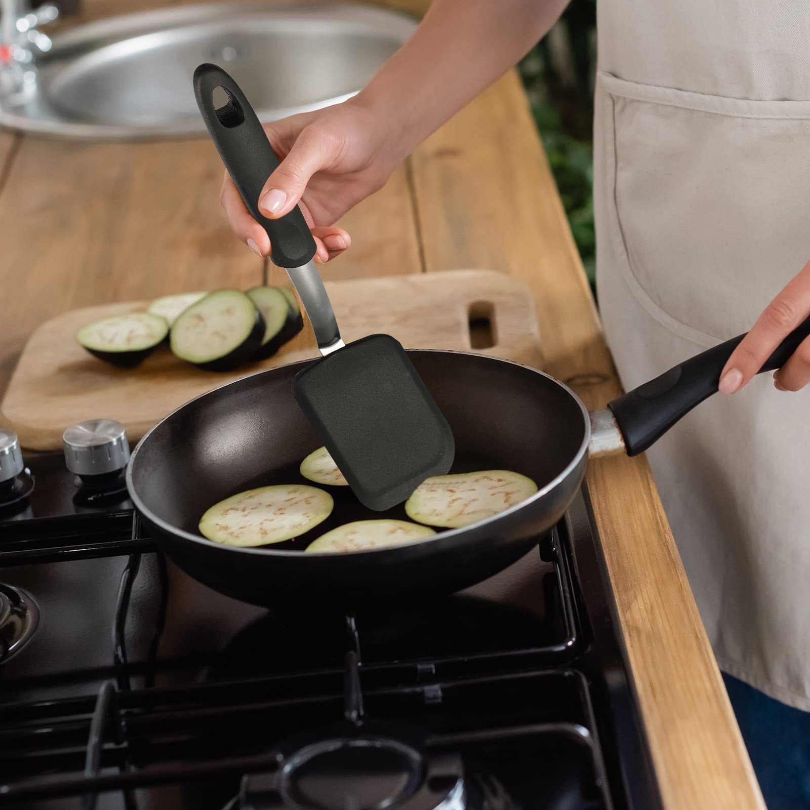Gejoy spatula closeup with baked goods, flexible silicone for delicate treats.