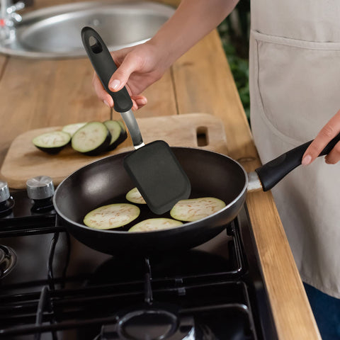 Gejoy spatula closeup with baked goods, flexible silicone for delicate treats.