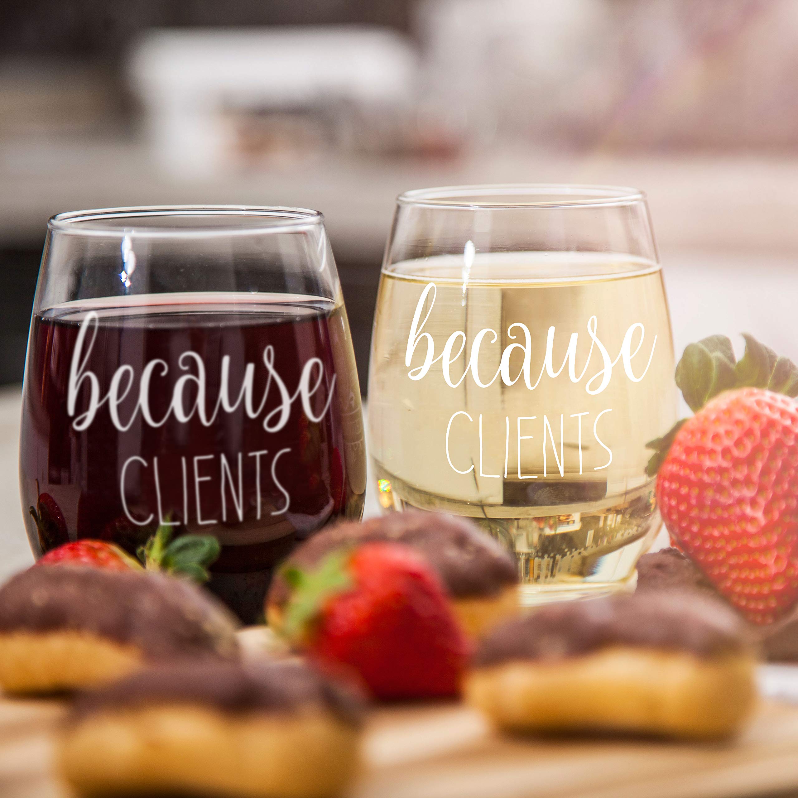 Gelid Because Clients stemless wine glass being held during toast