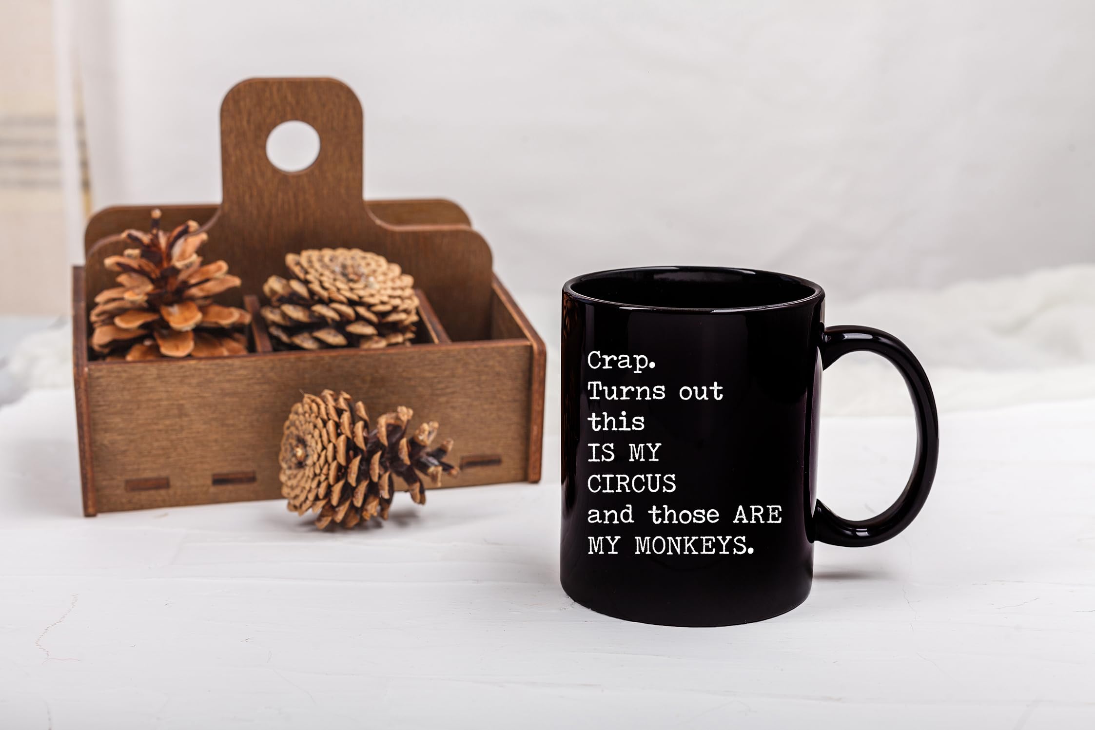Gelid Circus Monkeys mug held at desk shows comfortable grip.