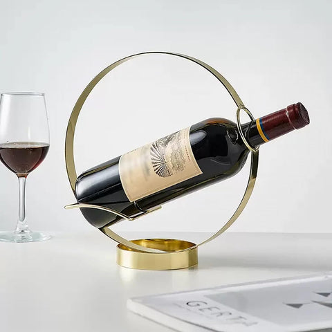 GeLive Gold Wine Bottle Holder on bar counter enhances ambiance.