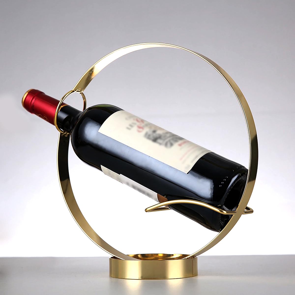 GeLive Gold Wine Bottle Holder on tabletop for elegant wine presentation.