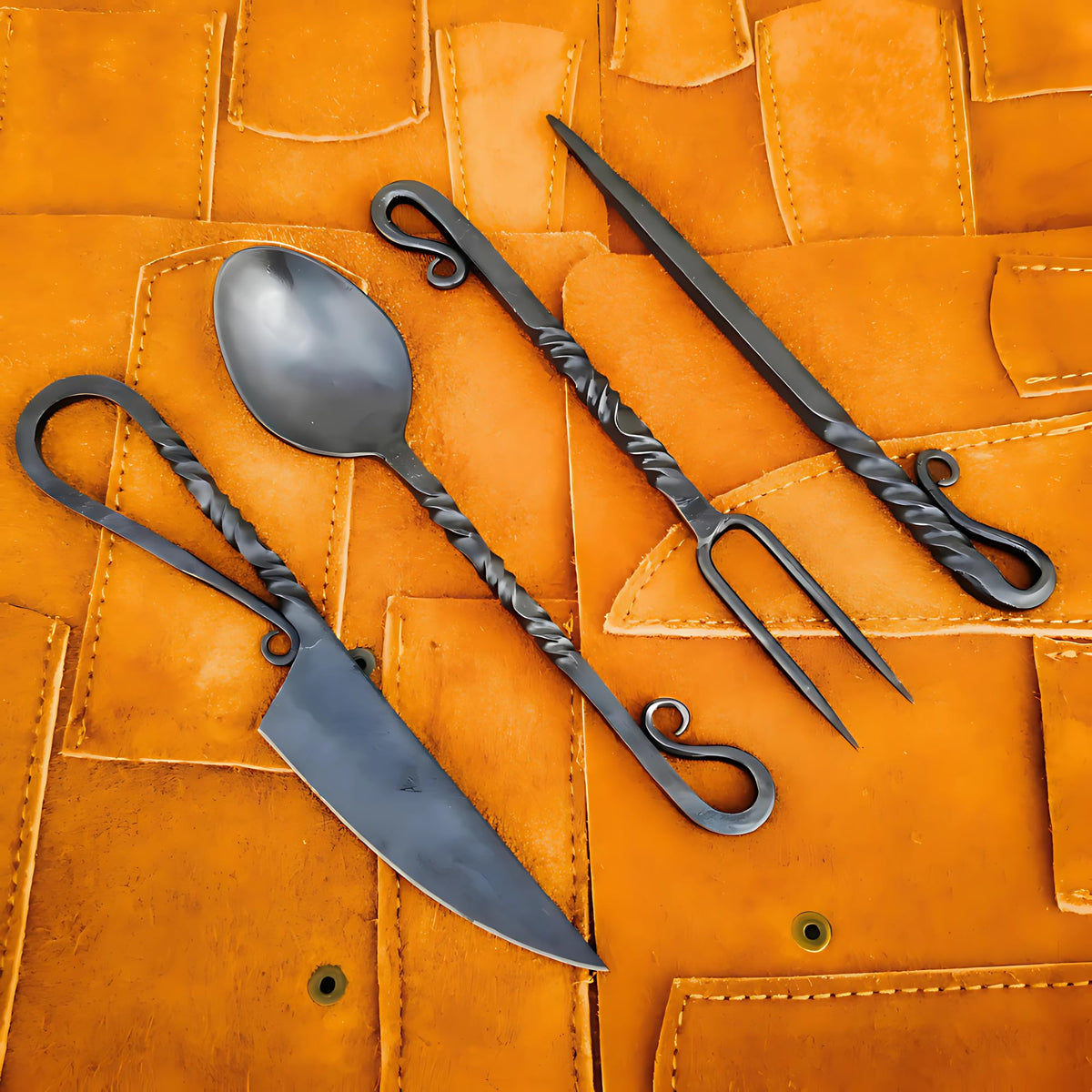 Generic hand-forged medieval cutlery set front view, durable outdoor dining option.