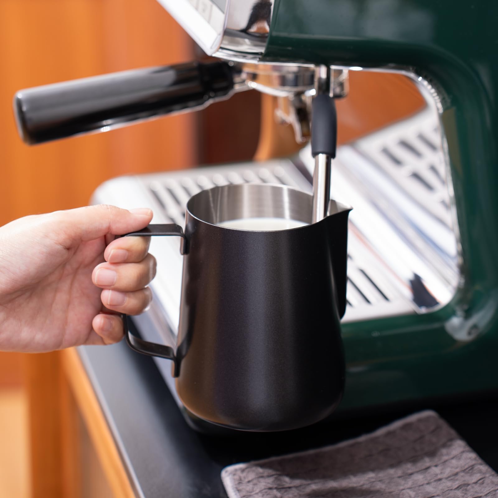 Generic stainless steel milk pitcher is dishwasher safe for quick cleanup.