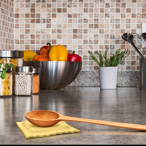 Genuine Fred SAUCED UP dishwashersafe ravioli spoon rest provides easy cleanup.
