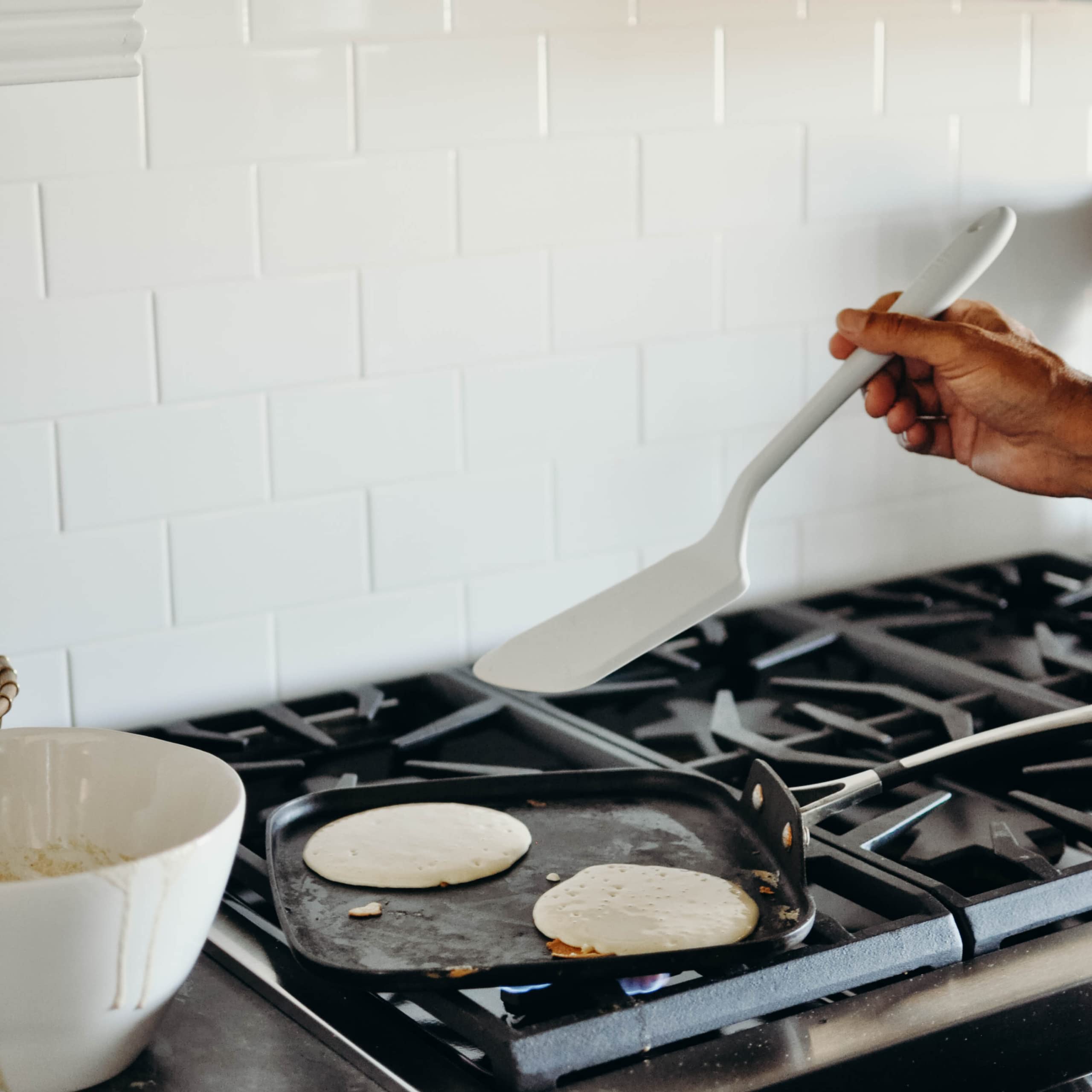 GIR Premium Ultimate Silicone Spatula Turner sautéing vegetables with fast, clean turnover.