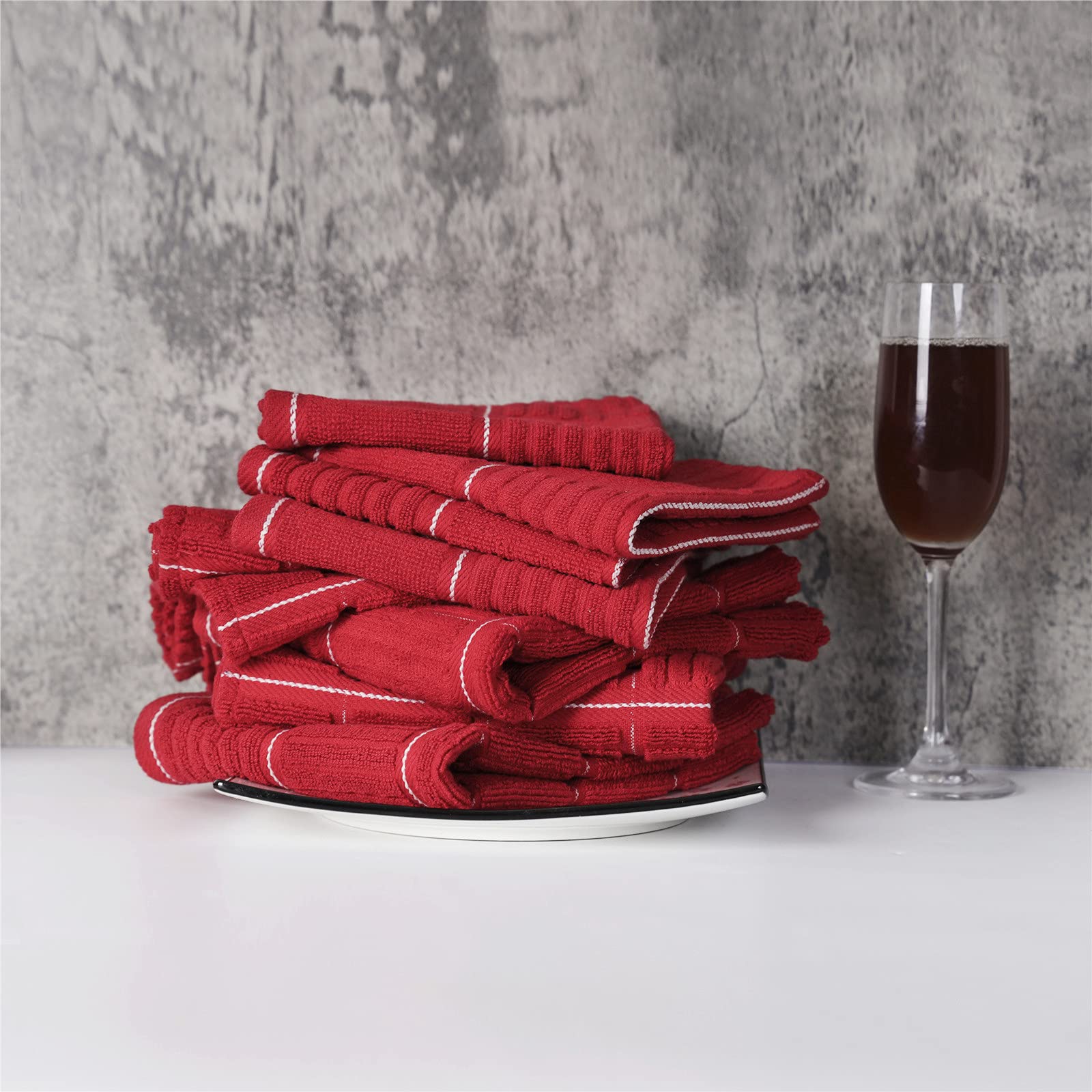 Glynniss red towels drying glassware and dishes with high absorbency and speed.
