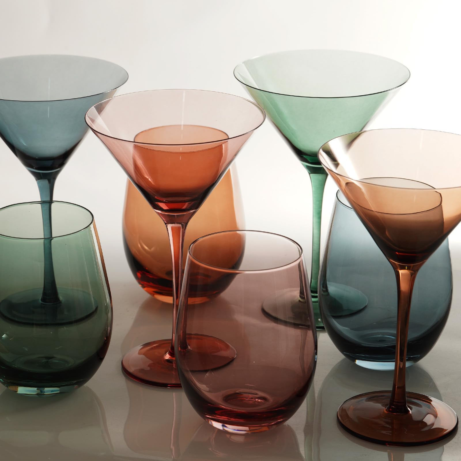 Gnimihz elegant home bar scene featuring the colored martini glasses.