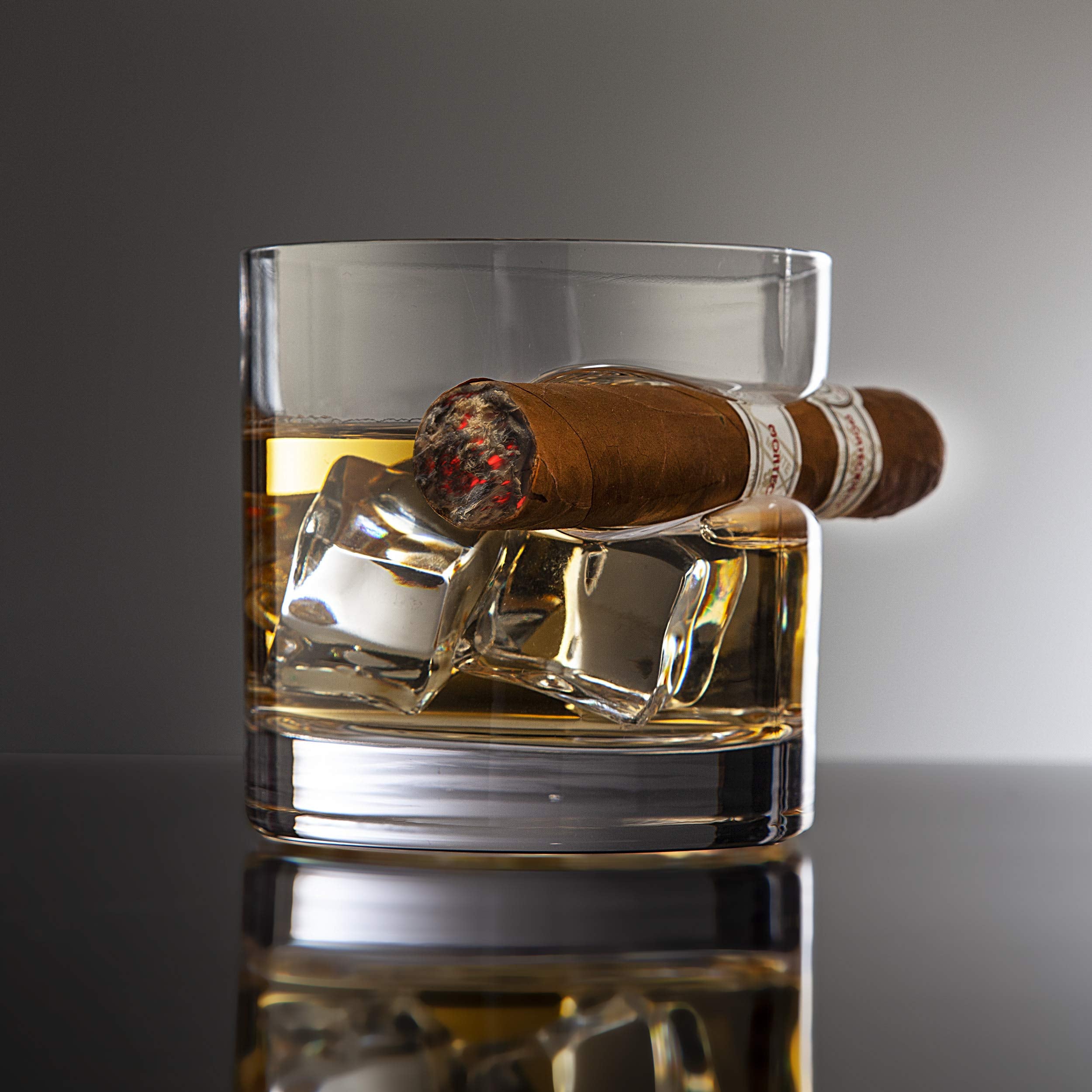Godinger gift idea for cigar lovers combining whiskey glass and cigar resting.