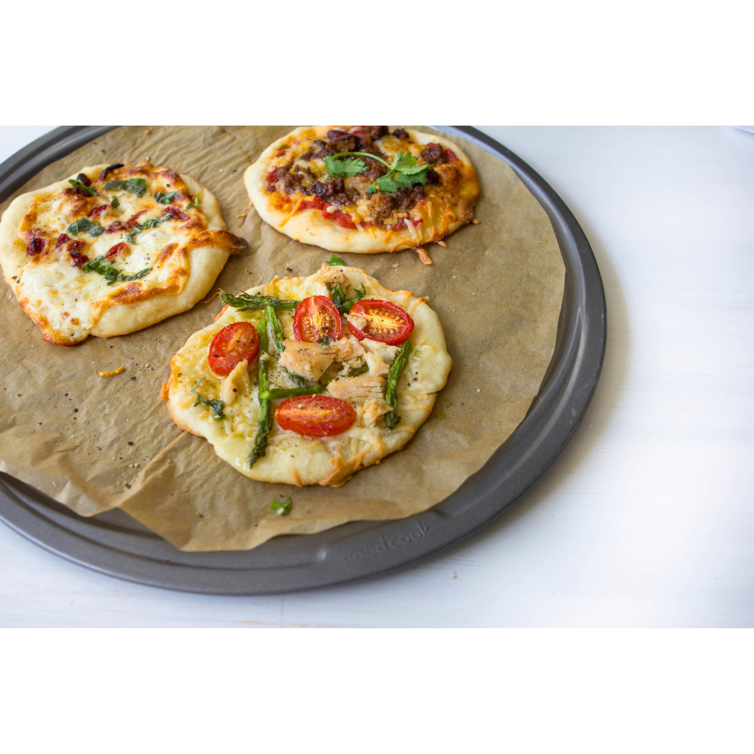 GoodCook pizza pan featuring scratch-resistant nonstick coating for release.