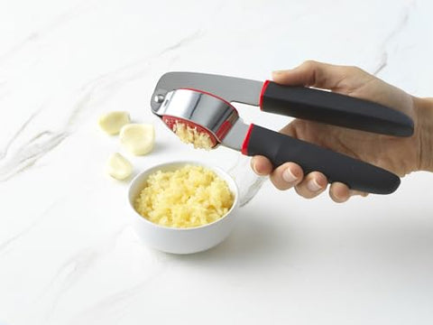 GoodCook Touch garlic press shows non-slip grip for secure, comfortable use.