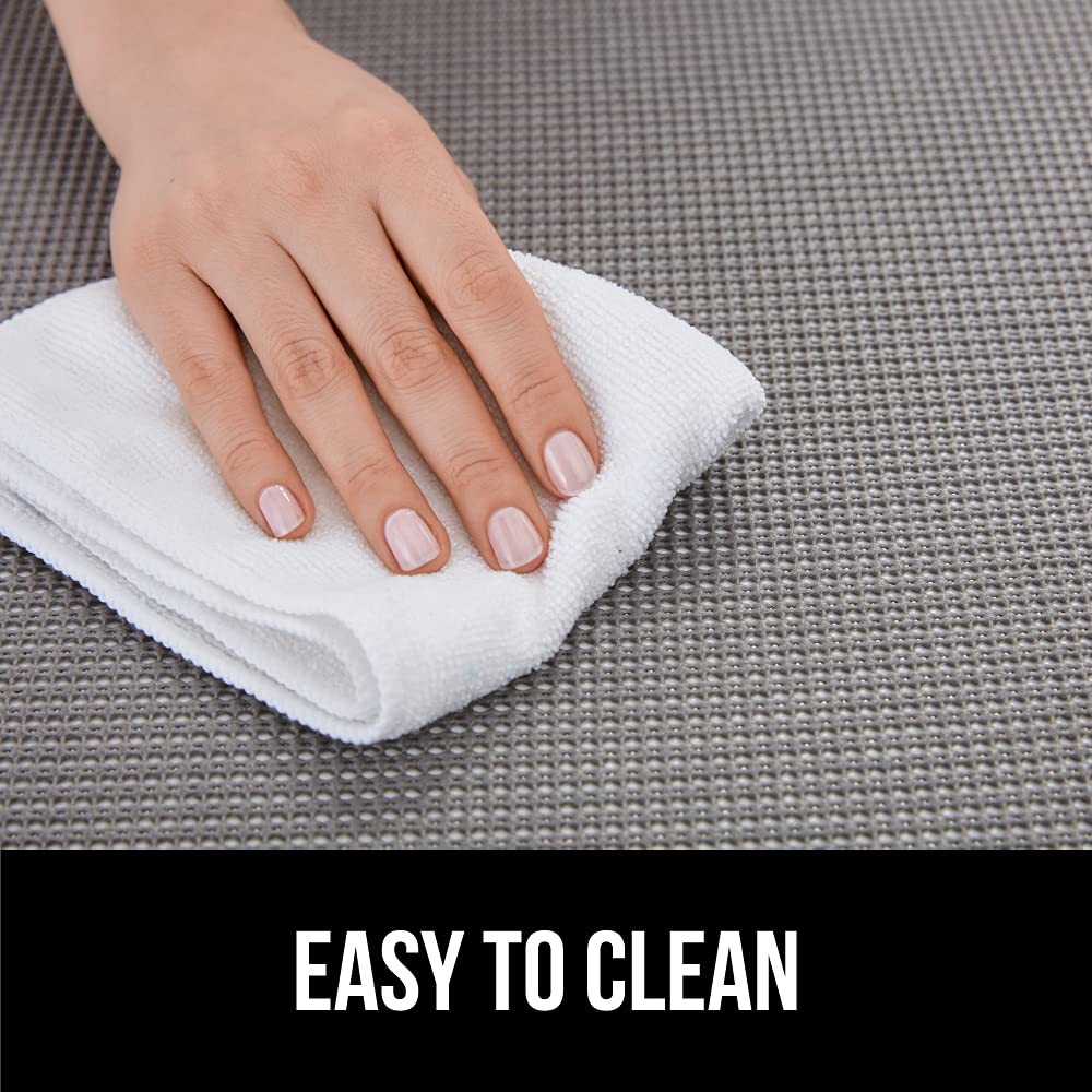 Gorilla Grip powerGRIP liner in a laundry area, guarding cabinet interiors from dirt.