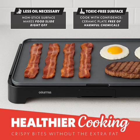 Gourmia pull-out drip tray design for mess-free cooking.