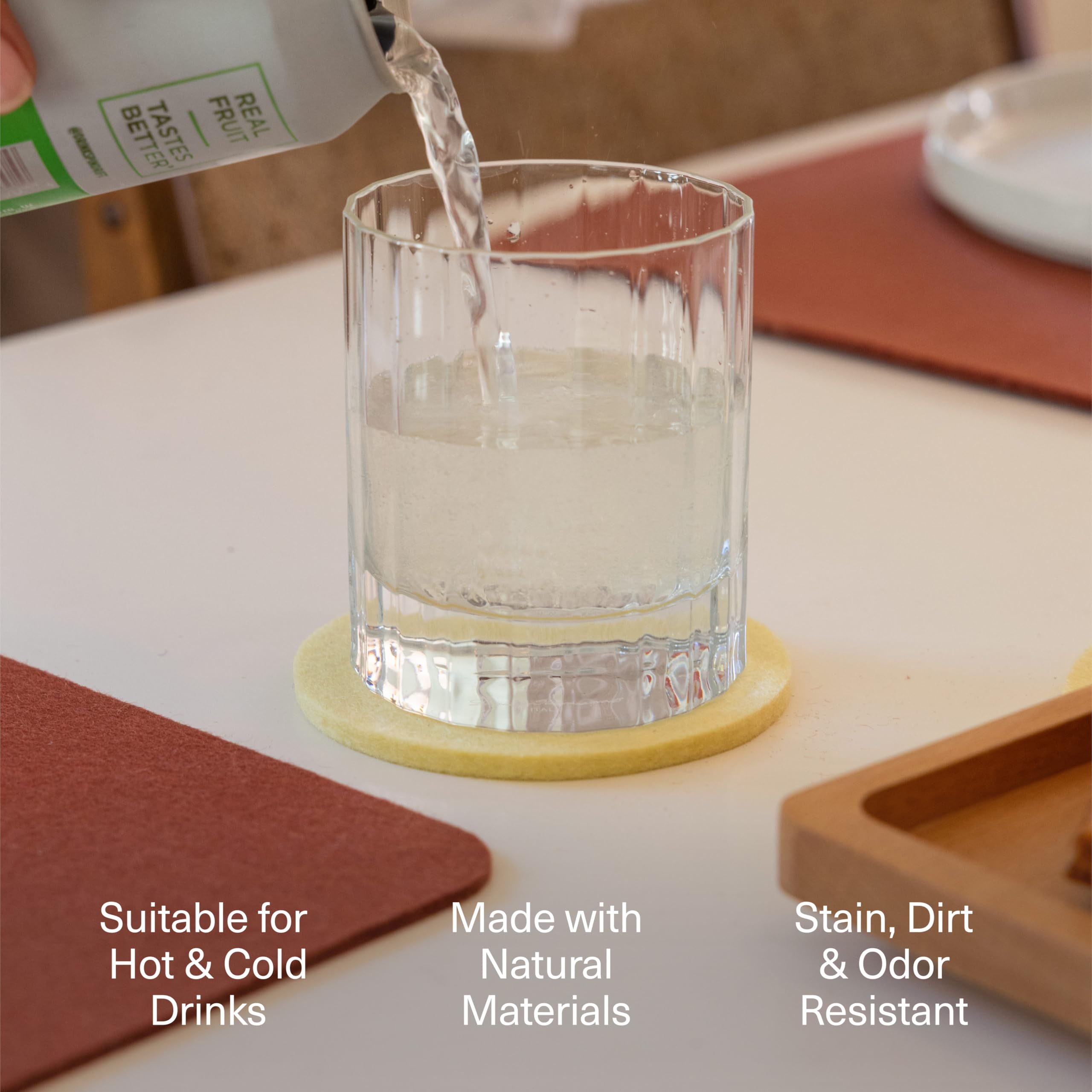 Graf Lantz merino-wool round coasters withstand heat while preserving surface finish.
