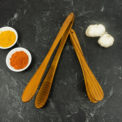 Graindi teak tongs high-heat ready for grills and skillets.