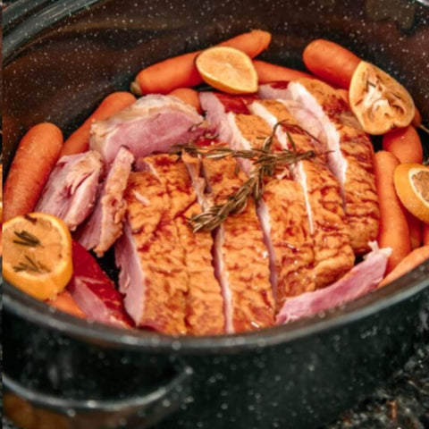 Granite Ware oval roaster depicted as dishwasher safe for easy cleanup.