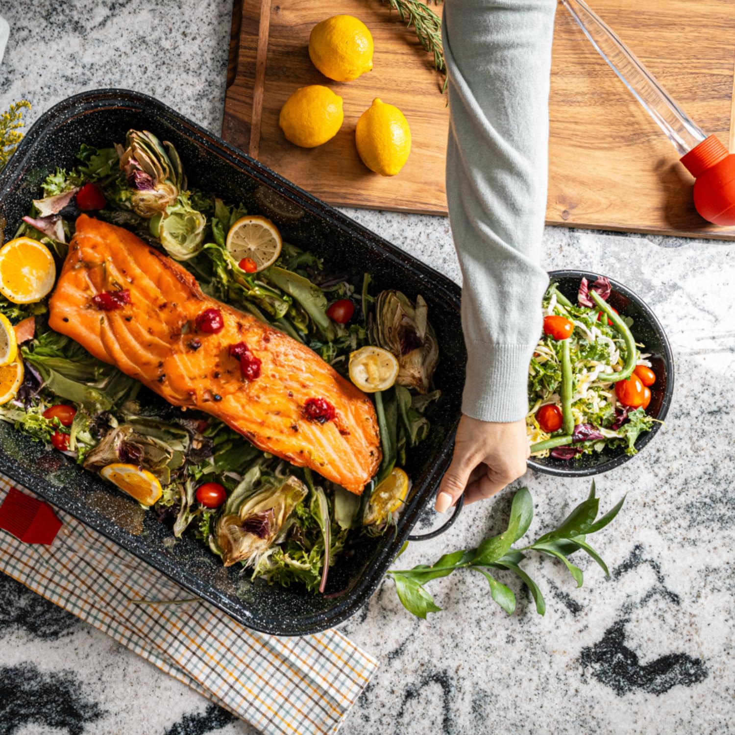 Granite Ware 21-inch roaster with lid on demonstrates moisture retention for juicy roasts.