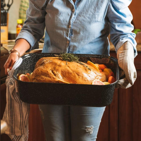 Granite Ware speckled black enamel roaster inside view showing even heat distribution.