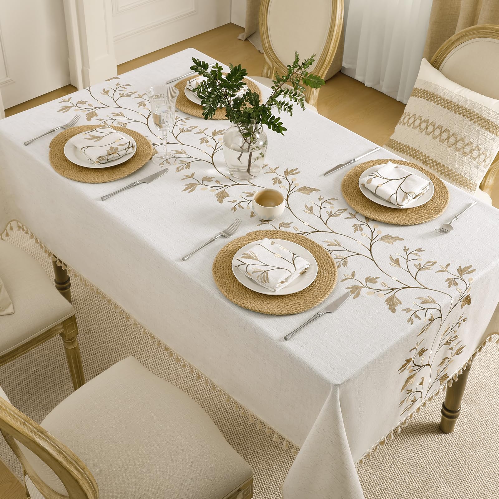 Closeup shows maple vine embroidery on GRASiMOSY tablecloth for elegant centerpiece