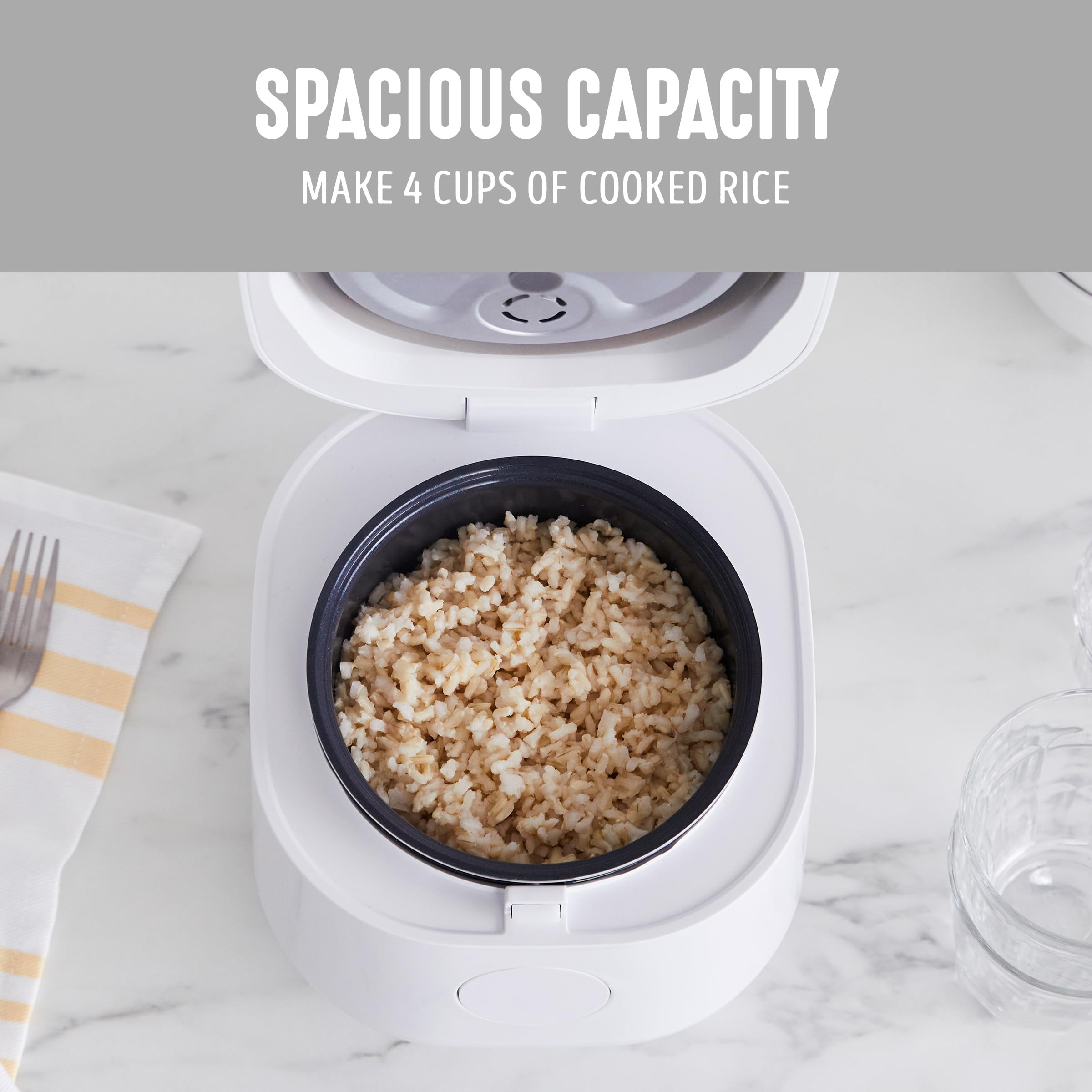 GreenLife compact cooker demonstrates 4-cup cooked capacity for families.