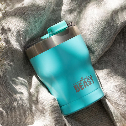 Greens Steel Beast 10oz tumbler close-up splash-proof lid in use